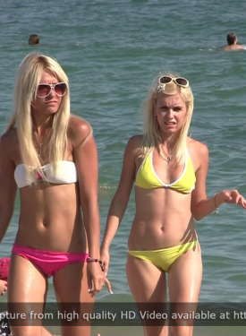Candid beach girls walking and dancing in bikini